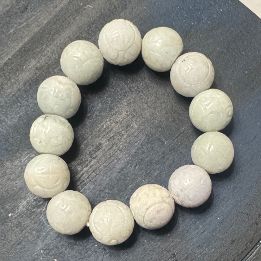 Antique Carved Jade Bead Stretch Bracelet with Floral Motif.